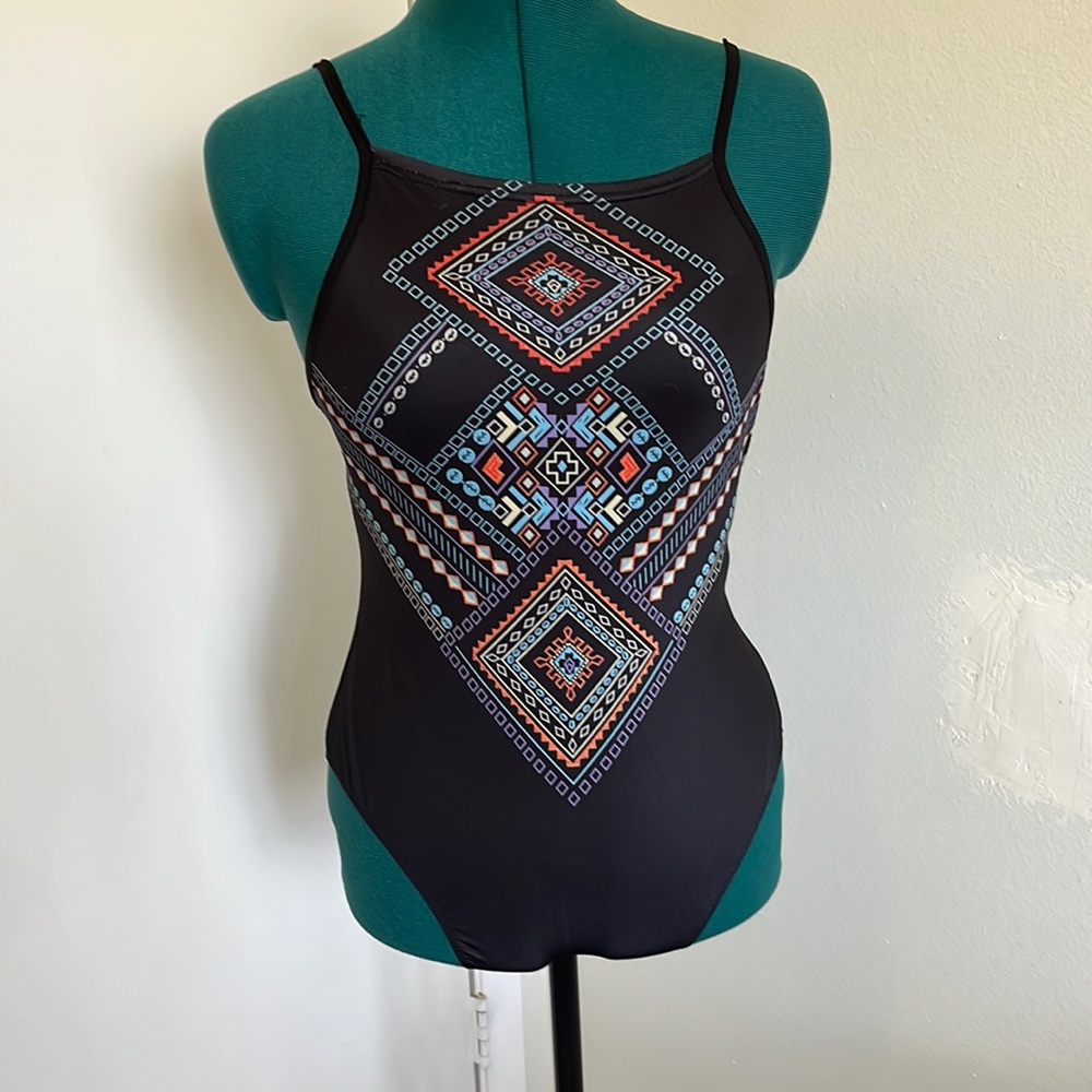 Beautiful swimsuit. Very open back. Size L but seems like a S